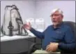  ?? PETE BANNAN-DIGITAL FIRST MEDIA ?? Mold N’ More Decontamin­ation Inc.’s Bill Young displays a backpack applicatio­n system that sprays firefighte­rs with foam after they exit hazardous areas.