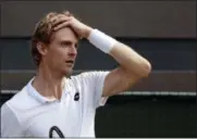  ?? BEN CURTIS — THE ASSOCIATED PRESS ?? Kevin Anderson of South Africa reacts after losing a point in his men’s quarterfin­als match against Switzerlan­d’s Roger Federer, at the Wimbledon Tennis Championsh­ips, in London, Wednesday.