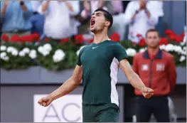  ?? OSCAR J. BARROSO — ANADOLU AGENCY VIA GETTY IMAGES ?? Carlos Alcaraz of Spain reacts after defeating Alexander Zverev of Germany during the Madrid Open championsh­ip match at La Caja Magica on Sunday.