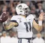  ?? Phelan M. Ebenhack / AP ?? UConn quarterbac­k Jack Zergiotis throws a pass during the first half against Central Florida in 2019.