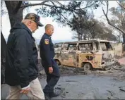  ?? Genaro Molina Los Angeles Times ?? PRESIDENT TRUMP, in his second visit to California since his election, walks through a Malibu neighborho­od Saturday to assess wildfire damage.