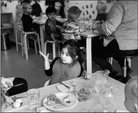  ?? MATHIAS SVOLD / NEW YORK TIMES FILE ?? Children, ages 2 and 3, eat lunch Nov. 29, 2019, at a public child care center in Copenhagen, Denmark.