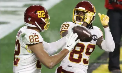  ?? Photograph: Charles LeClaire/USA Today Sports ?? Logan Thomas celebrates his touchdown with wide receiver Cam Sims.