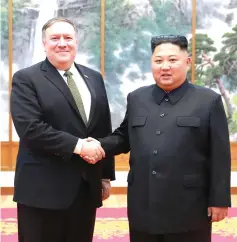  ??  ?? File photo shows Kim (right) shaking hands with Pompeo at the Paekhwawon State Guesthouse in Pyongyang. — AFP photo