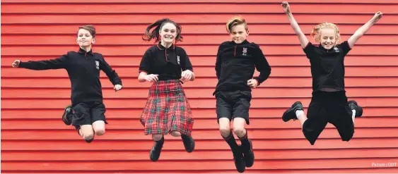  ?? Picture / ODT ?? Dunedin North pupils (from left) Caspar Rennie-Weston, 11, Ella Clarke, 12, James Johnson, 13, and Taya Kain, 11. The school offers five uniform options.