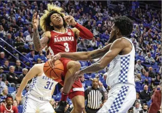  ?? ?? ABOVE: Alabama’s JD Davison (3) has the ball stripped by Kentucky’s Keion Brooks Jr. (right) during the second half Saturday in Lexington, Ky. Kentucky’s second half included a 20-2 run.