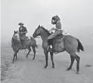  ?? MIKE CLARK/THE BILLINGS GAZETTE VIA AP ?? Isaac Slabaugh and Fannie Stutzman are surrounded by smoke as a wildfire moves toward Ashland, Mont., on Tuesday.