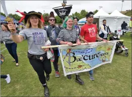  ?? Dan Watson/The Signal ?? Team Buc‘CURE’neers dress as pirates and walk for the 19th year Saturday during the sponsor lap at the event, which was held at Central Park.