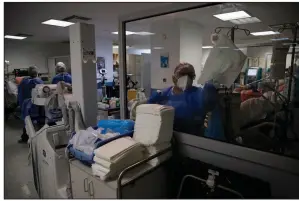  ?? (AP/Thanassis Stavrakis) ?? Cleaning worker Anthoula Dimitra Pagoun disinfects an intensive care unit at Sotiria Thoracic Diseases Hospital in Athens, Greece.