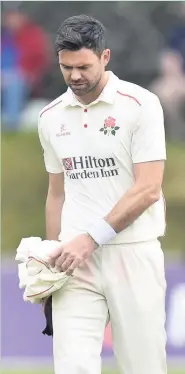  ??  ?? James Anderson walks off the pitch injured at Sedbergh