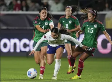  ?? RYAN SUN — THE ASSOCIATED PRESS ?? United States forward Sophia Smith, front, falls while vying for the ball against, from back left to right, Mexico defender Rebeca Bernal, midfielder Alexia Delgado and defender Cristina Ferral during tournament play on Monday in Carson, Calif.