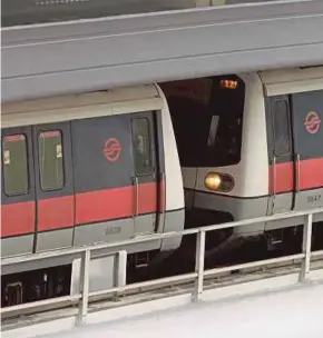  ??  ?? The two trains that collided at the Joo Koon Station yesterday.
