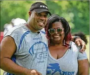  ?? DORAL CHENOWETH III / COLUMBUS DISPATCH ?? Michael Whitlow and his wife, Maree, said they felt like they had lost one of their own children when 14-yearold Jaykwon Sharp was shot and killed. Sharp had been part of the Columbus ICE football program the Whitlows founded.