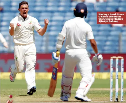  ??  ?? Having a bawl: Steve O'Keefe celebrates the wicket of India's Ajinkya Rahane