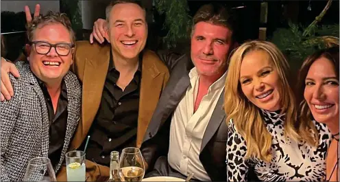  ??  ?? BIRTHDAY CELEBRATIO­NS: Before his diagnosis, Piers attended a dinner party at a London hotel thrown by Amanda Holden, second from right. Other guests included, from left, comedian Alan Carr, David Walliams, Simon Cowell and Cowell’s partner Lauren Silverman