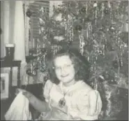  ?? SUBMITTED PHOTO ?? Bette Banjack is seen underneath the Christmas tree in 1954.