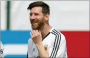  ?? RICARDO MAZALAN — THE ASSOCIATED PRESS ?? Lionel Messi smiles during a training session of Argentina at the 2018 soccer World Cup in Bronnitsy, Russia Sunday.