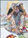  ?? RAVI KUMAR/HT ?? A street vendor takes cover under a cardboard box on a hot Tuesday at the Sector 17 ISBT in Chandigarh.