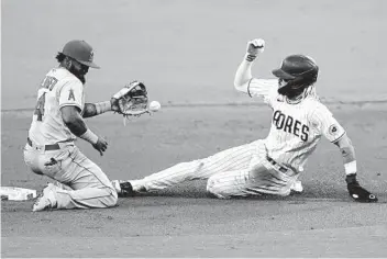  ?? GREGORY BULL AP ?? The Padres may hit for power, but their running game, including Fernando Tatis Jr. (above), is a key, too.
