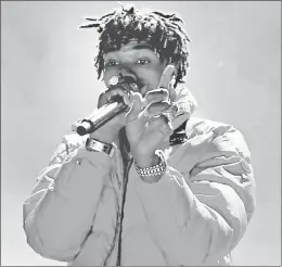  ?? KEVIN WINTER/GETTY ?? “My Turn” from Lil Baby, who is seen performing March 2, is 2020’s most-streamed album.