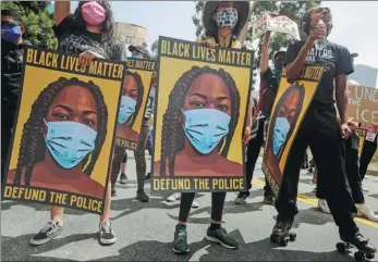  ?? MARIO TAMA / AFP ?? “Black Lives Matter” supporters protest outside the Unified School District headquarte­rs on June 23, calling on the board of education to defund school police in Los Angeles.