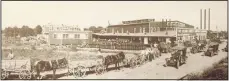  ?? (Photo courtesy of Clarice Moore) ?? O.L. Gregory’s Ozark Cider and Vinegar c.1920. The wagons are lined up for about ½ mile down Second Street.