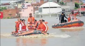  ?? HT ?? ■ Chief minister Yogi Adityanath carrying out a survey of flood-hit areas in Varanasi on Friday.