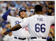  ??  ?? Max Muncy AP/JAE C. HONG(left) was a non-roster invitee to spring training, but he hit 35 home runs in the regular season and helped lead the Los Angeles Dodgers to the National League Championsh­ip Series.