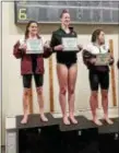  ??  ?? Garnet Valley’s Noelle DiClemente, left, poses with her certificat­e for winning first place in the 50 freestyle at the Central League championsh­ips Friday. Second was Penncrest’s Claire Walsh, center, with Conestoga’s Sophia Poeta third.