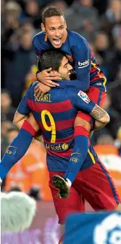  ?? — AFP
— AFP ?? Barcelona’s Luis Suarez ( left) celebrates with team mate Neymar after scoring against Athletic Bilbao in their Spanish League match at Camp Nou in Barcelona on Sunday. The hosts won 6- 0.