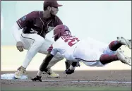  ?? NWA Democrat-Gazette/CHARLIE KAIJO ?? Arkansas’ Christian Franklin (right) is doubled off third base by Florida State’s Drew Mendoza after Matt Goodheart’s lineout during the Razorbacks’ loss to the Seminoles on Saturday during the College World Series at TD Ameritrade Park in Omaha, Neb.