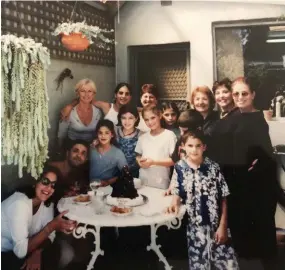  ??  ?? Clockwise from far left: a photograph of Abla Amad with her granddaugh­ter, Abbey; Amad’s daughter-in-law, Nafflie, in the restaurant; Abla (third from the right) and her family.