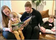  ?? (Courtesy of Starsiak-Hawk) ?? HGTV’s “Good Bones” star Mina Starsiak-Hawk with her husband, Steve, reads her new children’s book to son, Jack, 2, as daughter, Charlie, 4 months, listens in.