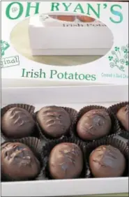  ?? PHOTO BY EMILY RYAN ?? Dark chocolate covers these Oh Ryan’s Irish Potatoes.