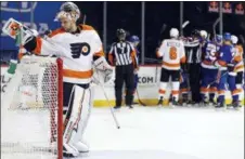  ?? ADAM HUNGER — THE ASSOCIATED PRESS ?? Flyers goalie Petr Mrazek takes a breath after the first of two Mathew Barzal goals for New York Tuesday night at Barclays Center. The Islanders won via Barzal’s second goal by 5-4.