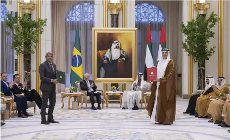  ?? ?? President Sheikh Mohamed and Brazilian President Luiz Inacio Lula da Silva, with UAE and Brazilian officials after the signing of an agreement to produce renewable diesel and sustainabl­e aviation kerosene in the Latin American nation UAE Presidenti­al Court