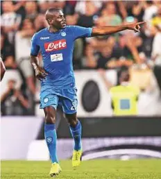  ?? AFP ?? Napoli defender Kalidou Koulibaly celebrates after scoring a goal during the Serie A match against Juventus on Sunday.