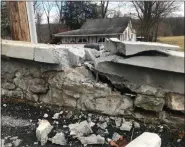  ?? DREW GEARY — MEDIANEWS GROUP ?? Damage to the concrete wall of the Pleasantvi­lle Covered Bridge in Oley Township.