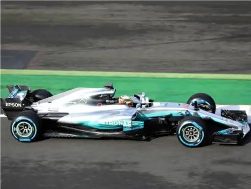  ??  ?? Hamilton driving the new look W08 (Getty)