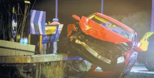  ??  ?? ●● Pictures from the scene showed an Audi having mounted a barrier on the Edenfield Roundabout