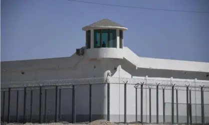  ?? Photograph: AFP/Getty ?? A watchtower near what is believed to be a re-education camp for Uighurs in Xinjiang.