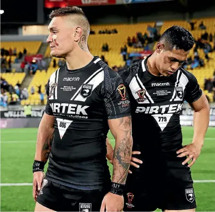  ?? PHOTO: GETTY IMAGES ?? Kiwis Danny Levi and Roger Tuivasa-Sheck look dejected after the shock loss in their World Cup quarterfin­al match against Fiji.