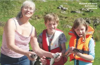  ??  ?? Maxwell and Ava’s first catch of mackerel