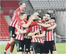  ??  ?? Sunderland stars celebrate beating Lincoln in the Papa John’s Trophy.