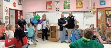  ?? / Floyd County Schools ?? Zach Mendence (pictured far right) is recognized in front of his students as Pepperell Elementary School’s Teacher of the Year, Floyd County Schools’ Elementary Teacher of the Year and Floyd County Schools’ 2019 System Teacher of the Year. He is standing with Tony Daniels (from right next to Mendence), BOE member for the Pepperell district; April Childers, deputy superinten­dent; John Parker, assistant superinten­dent; and Pepperell Elementary Principal Teri Pendley.