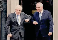  ??  ?? Legami economici.
Boris Johnson a Downing Street con il premier australian­o Scott Morrison