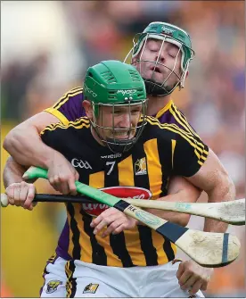  ??  ?? Kilkenny’s Paul Murphy is wrapped up by Wexford substitute Harry Kehoe.