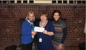  ?? SUBMITTED PHOTO ?? Attorney Lisa Comber Hall presents a check from Barbara Bochey’s estate to RoyerGreav­es Executive Director Vicky Mayer as Royer-Greaves Controller Michele Kraynak looks on.