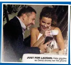  ??  ?? JUST FOR LAUGHS: Kate giggles as David shows her his phone