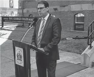  ?? STU NEATBY/THE GUARDIAN ?? Health Minister James Aylward speaks to media in front of the Coles Building last week. Aylward was questioned by Liberal MLA Robert Henderson about a $434,000 compensati­on package for doctors.